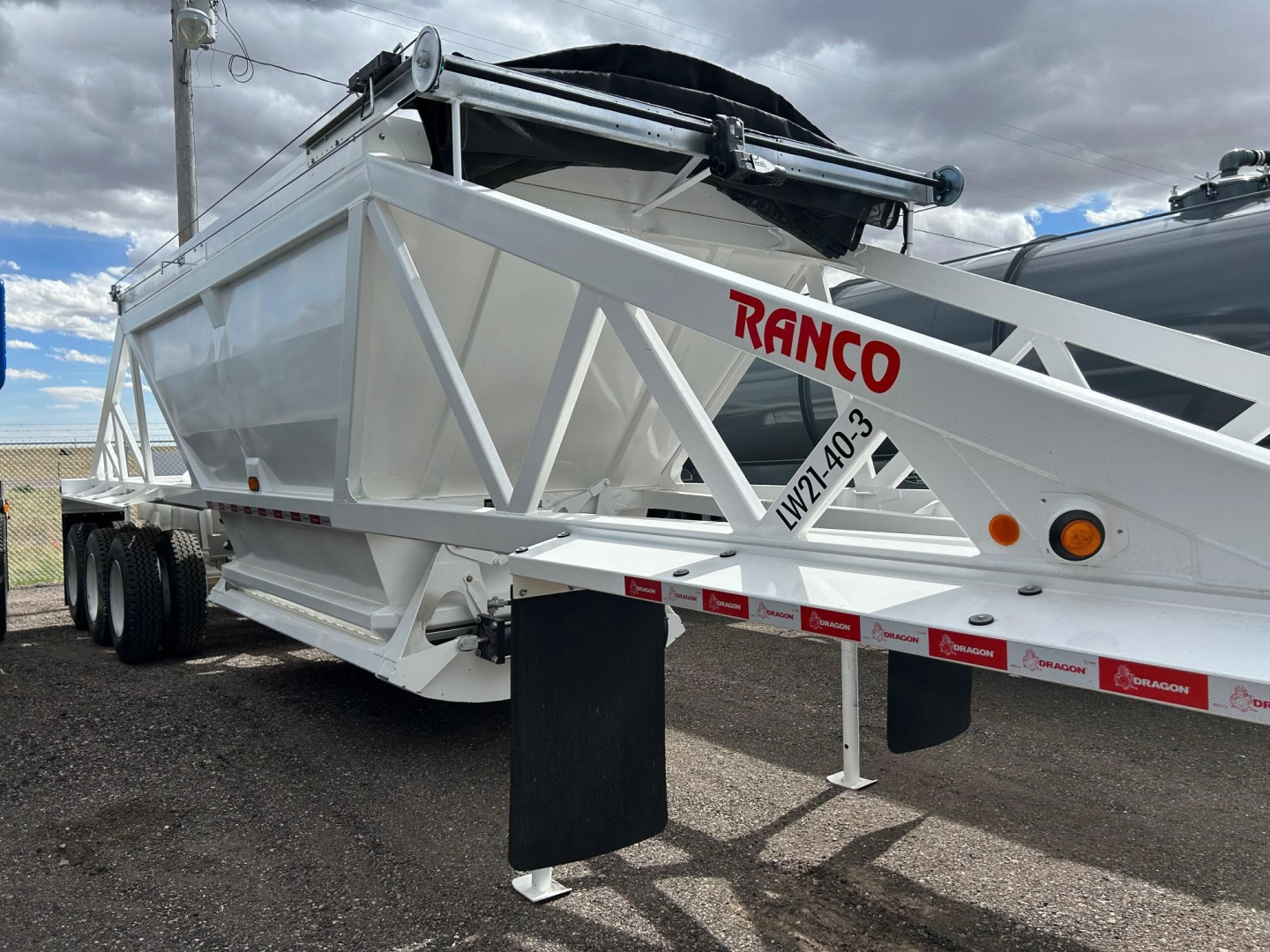 Ranco Versa dump trailer showing white steel framed body and red RANCO logo on side.