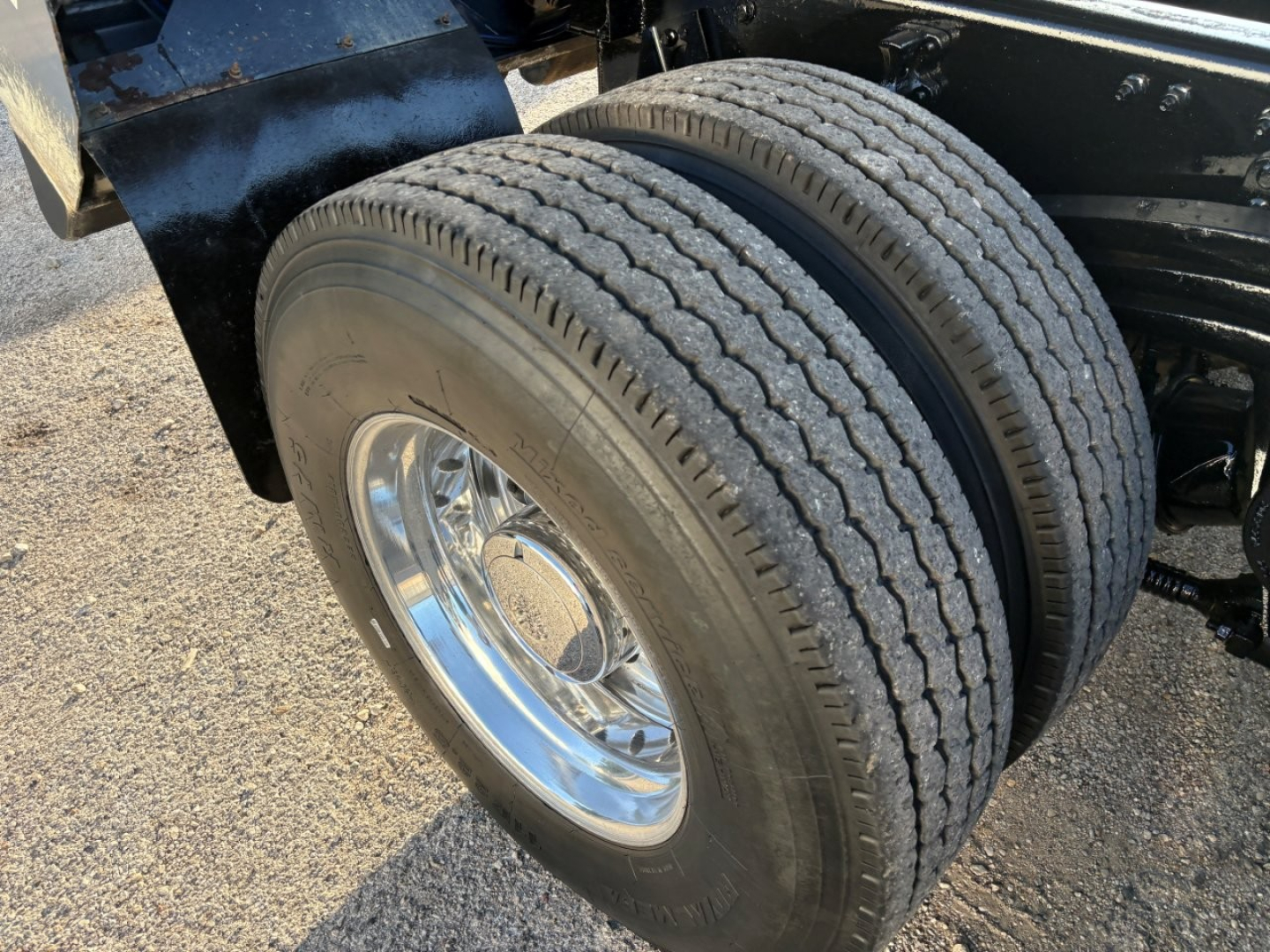 Volvo VHD truck rear dual wheels showing tires and chrome rims in the wheel well.
