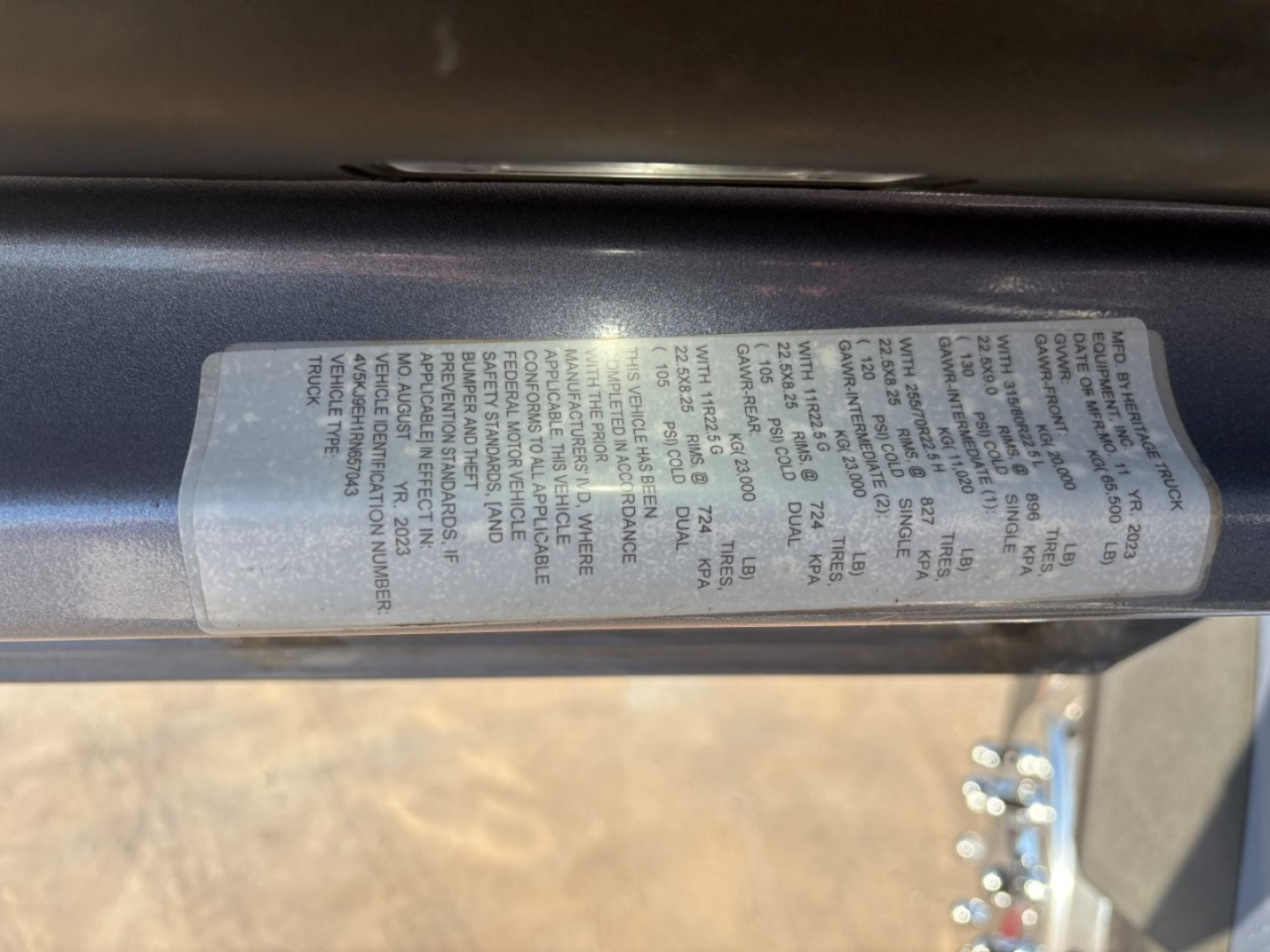 Label/Sticker on Volvo VHD104F300 truck door area with dense small text details.