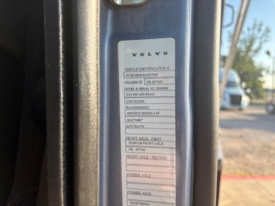 Volvo vehicle identification label showing VIN and chassis details on door frame, with model and serial numbers partially legible.