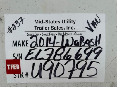 Trailer tag showing Mid-States Utility Trailer Sales, Inc. handwritten VIN 1JJV532DXEL786699 S/N EL786699 STK# U90795 on a white card with TFED logo.