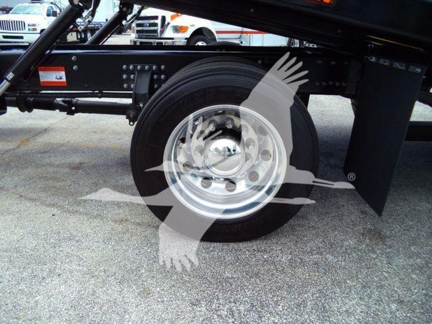 Mack MD6 truck undercarriage showing wheel, tire, and frame with branding watermark.
