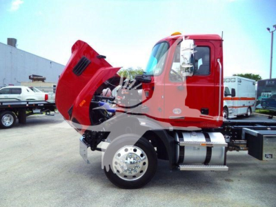 MD6 truck cab with hood open, red color, chrome fuel tanks and wheel, showing engine area and side view.
