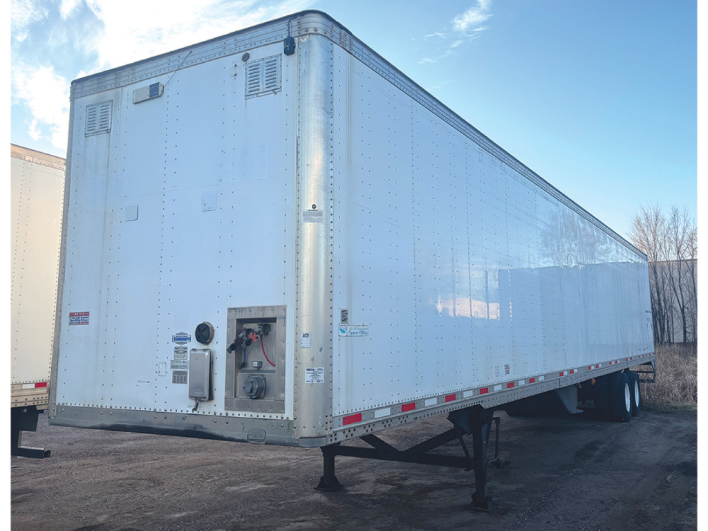 Ultralight aluminum Vanguard van trailer with riveted panels, showing front control box and rear corner with vents and lighter access.