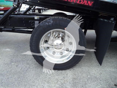 Kenworth T280 rollback truck wheel and undercarriage showing chrome wheel and tire with black chassis.