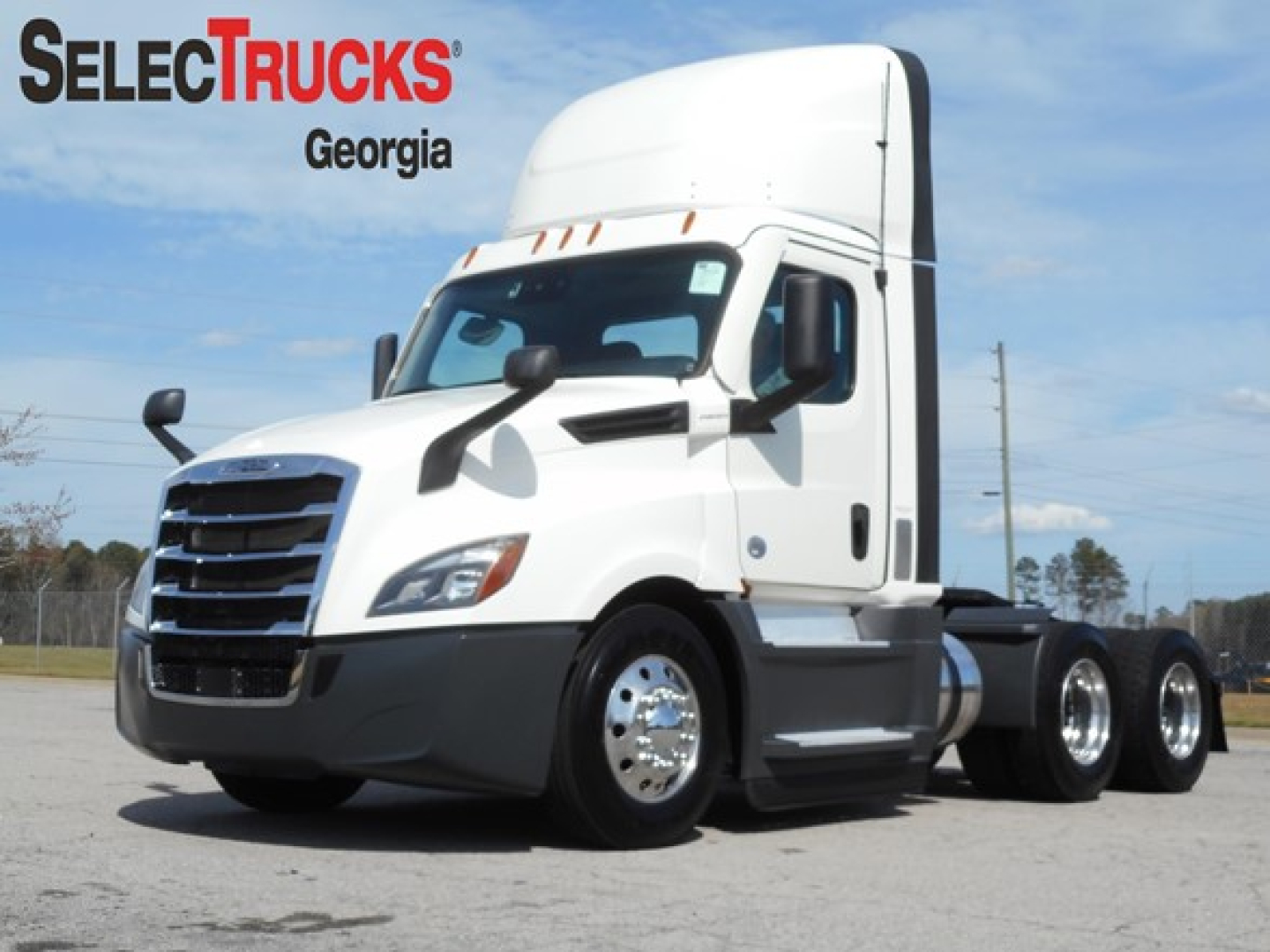 Freightliner Cascadia 126 day cab truck in white parked, SelectTrucks Georgia logo on image.