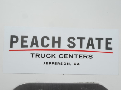 Peach State Truck Centers sign with PEACH STATE text and JEFFERSON, GA below.