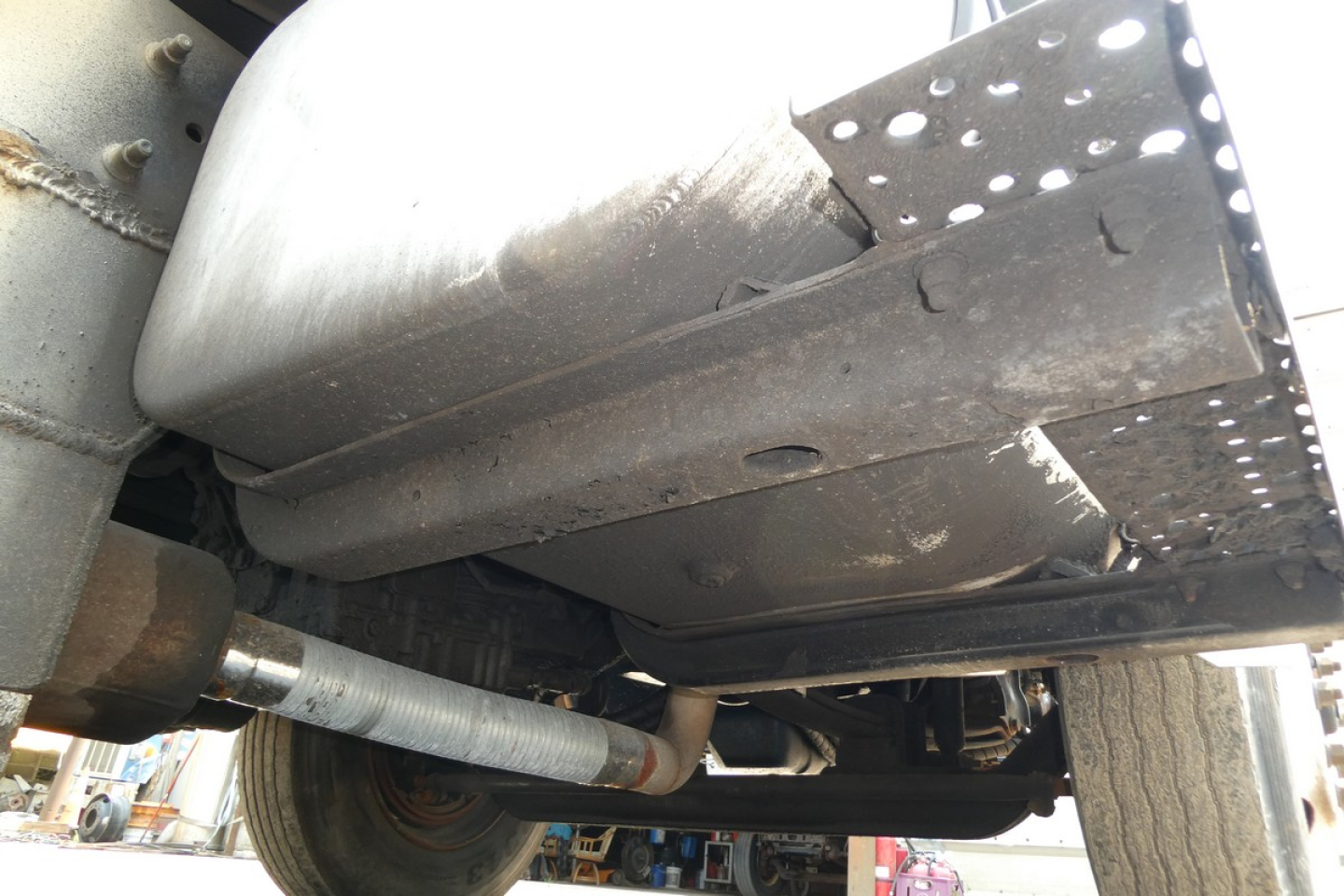 Underbody view of a 2005 International 4300 showing exhaust pipe and frame components.