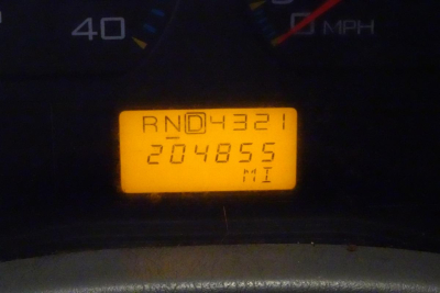 Instrument cluster showing odometer and gear indicator with illuminated display reading RN04321 204855