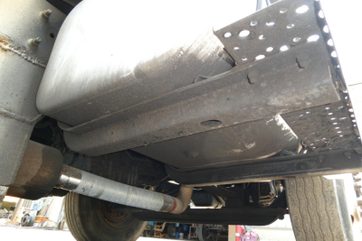Underbody view of a 2005 International 4300 showing exhaust pipe and frame components.
