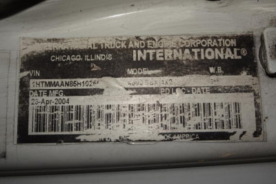 Vehicle identification label on International 4300 showing VIN 1HTMMAAN85H102552, model 4300 4x2, date: 23-Apr-2004, Chicago Illinois, barcode line.