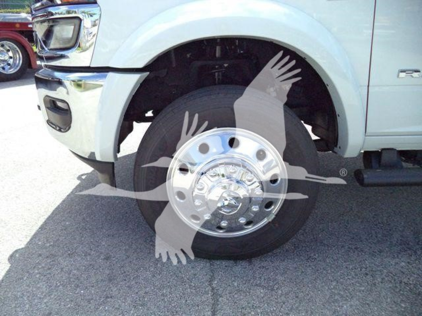 Truck wheel and front fender of a 2026 Ram 4500 with a chrome hubcap and tire, partial wheel well visible.