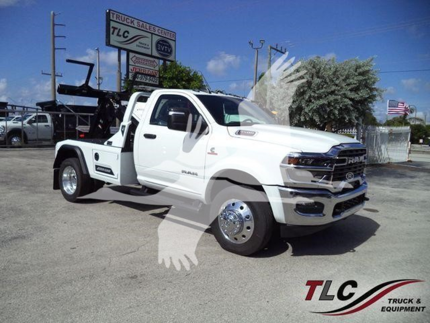 2026 Ram 4500 w/ winch features a heavy-duty tow setup and dual rear tires in a dealership lot.