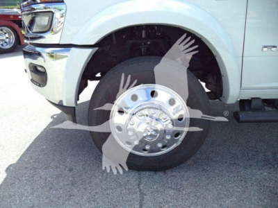 Truck wheel and front fender of a 2026 Ram 4500 with a chrome hubcap and tire, partial wheel well visible.