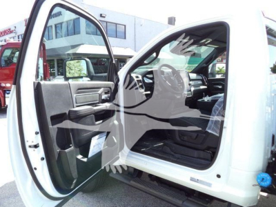 Ram 4500 cab interior view showing open front door, steering wheel, and dashboard with gray and black trim.