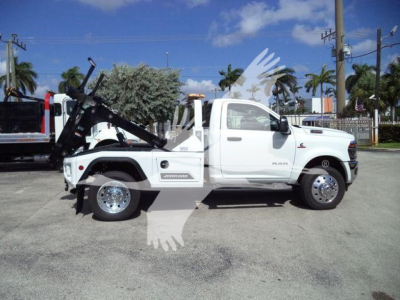2026 Ram 4500 in-service white cab with winch truck side view, VIN 3C7WRKAL0TG217748, stock J17748, label visible on door, utility vehicle