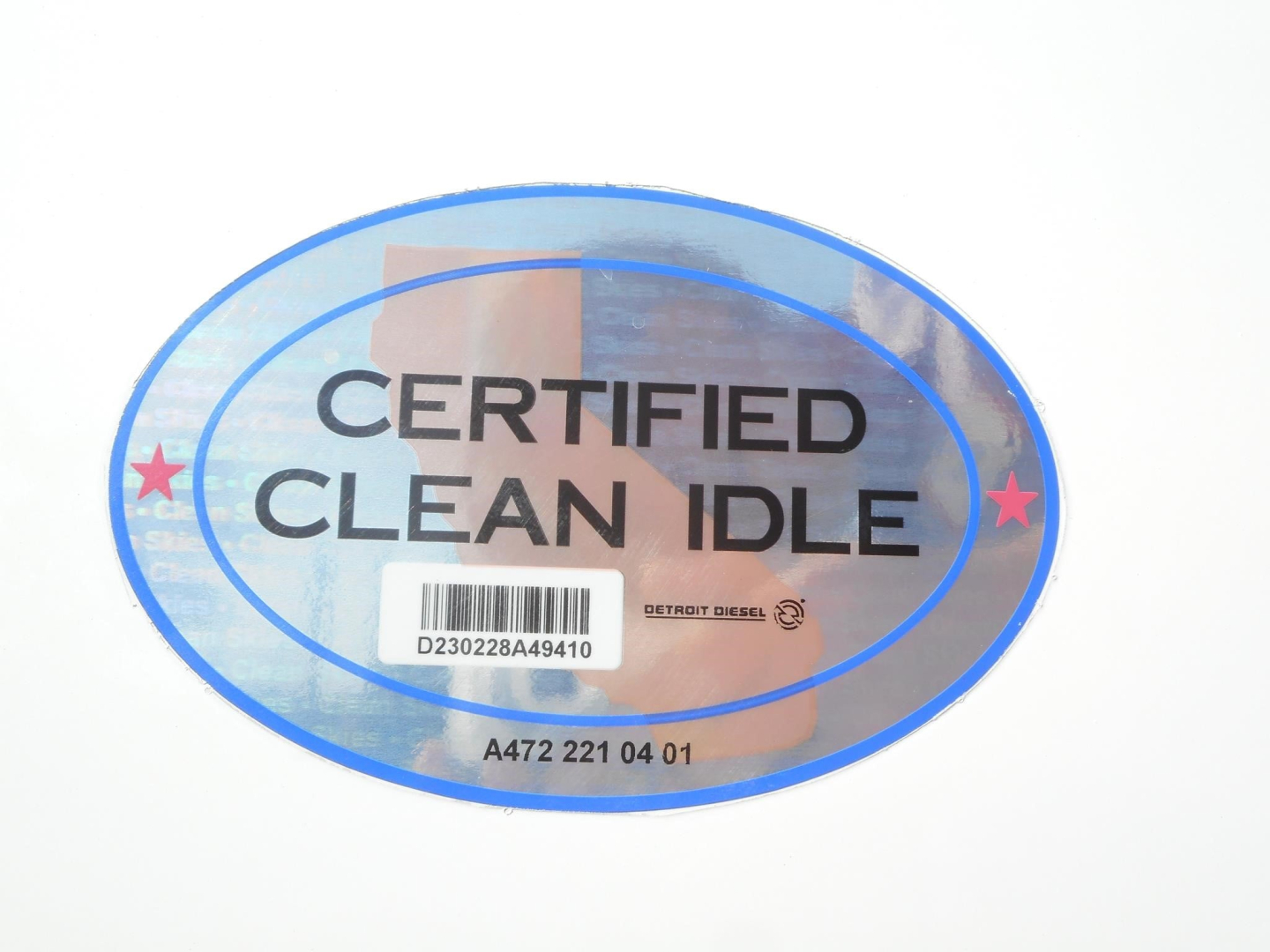 Oval sticker showing CERTIFIED CLEAN IDLE with barcode and Detroit Diesel logo.