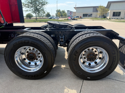 Dual rear wheels on a Kenworth T680 tractor showing chrome rims and Goodyear tires