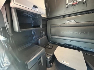 Freightliner Cascadia 126 interior cabin view showing sleeper area and storage compartments.