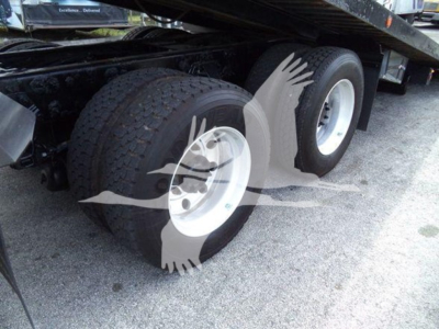 Truck rear wheels and dual axle setup of a 2014 Peterbilt 367 rollback truck showing dual tires and undercarriage components.