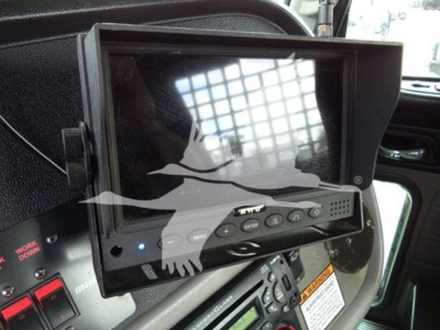 In-cab monitor display mounted in Peterbilt 367 showing touchscreen controls and dashboard nearby.