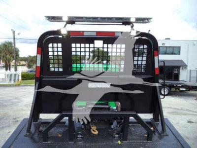 Peterbilt 367 rollback truck rear view with heavy-duty hitch and hydraulic equipment in truck bed.
