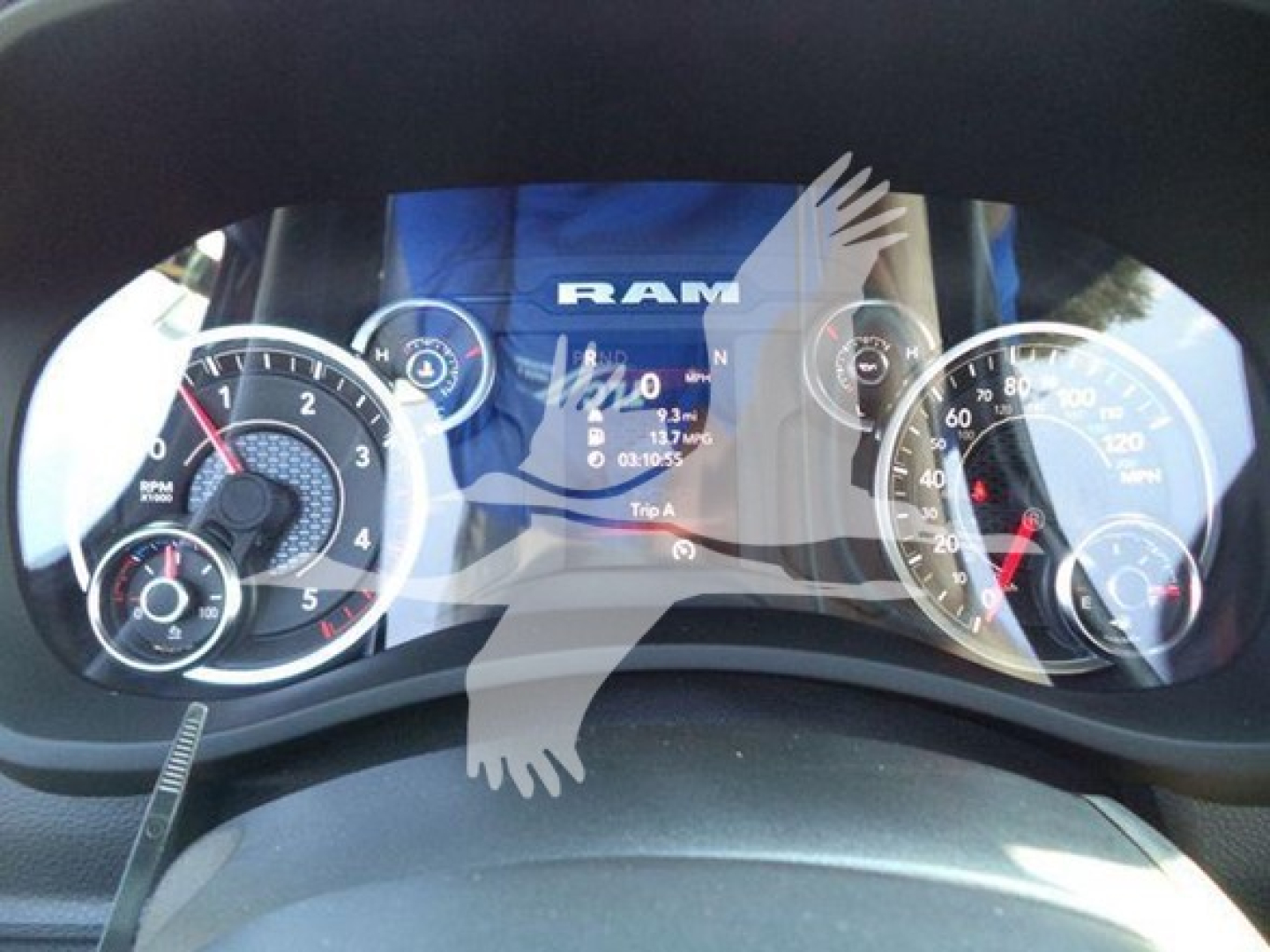 Ram 5500 dashboard cluster display with speedometer and tachometer, showing RAM logo and digital readout.