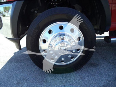 Ram 5500 truck front wheel and chrome hubcap showing Goodyear tire and wheel well.