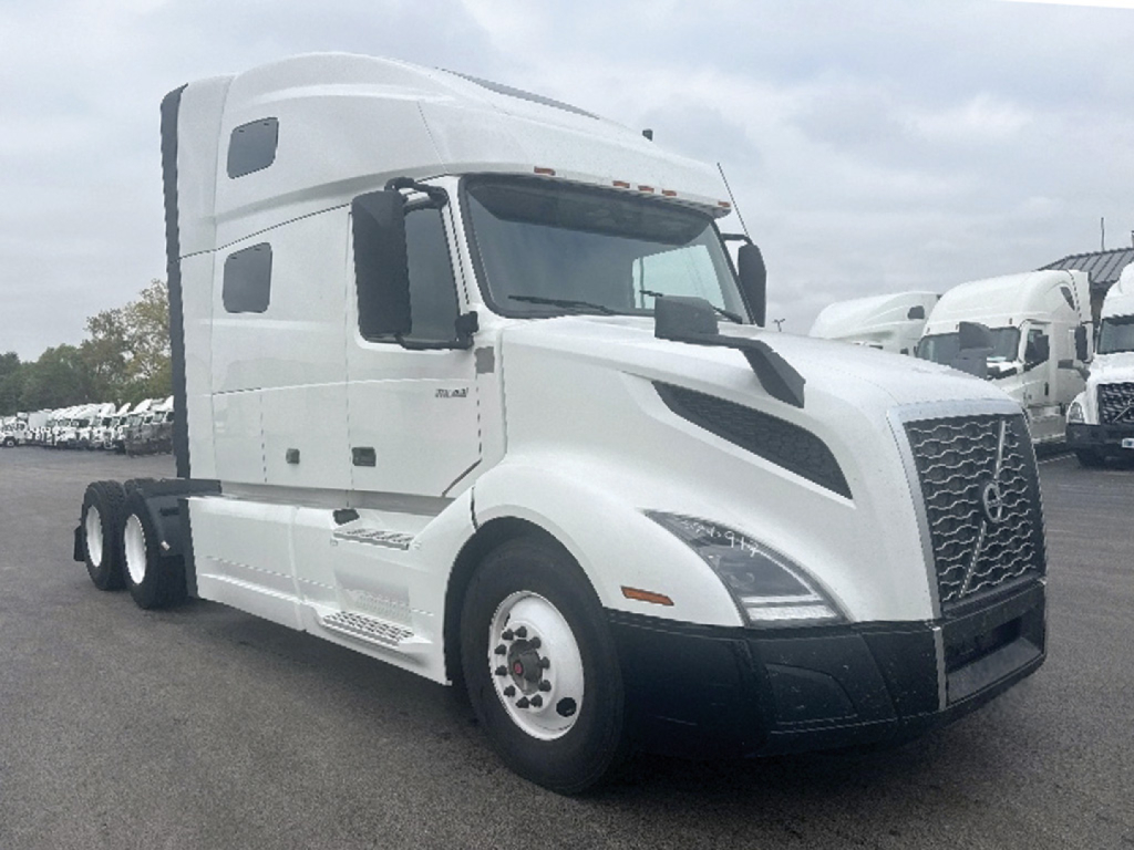 Volvo VNL 760 sleeper cab truck in white, side view, showing front grille, headlights, and dual rear axles.