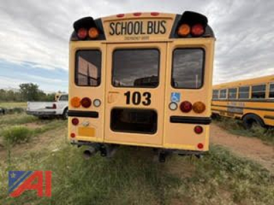 School bus CE Series rear view showing number 103 and handicap decal, with tail lights and back window.