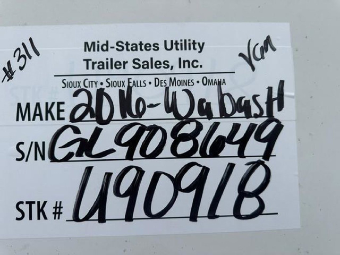 Trailer tag showing Make 20th-Wabash handwritten, S/N GL908649, STK # U490918, VIN 1JJV532D0GL908649 on Mid-States Utility Trailer Sales label.