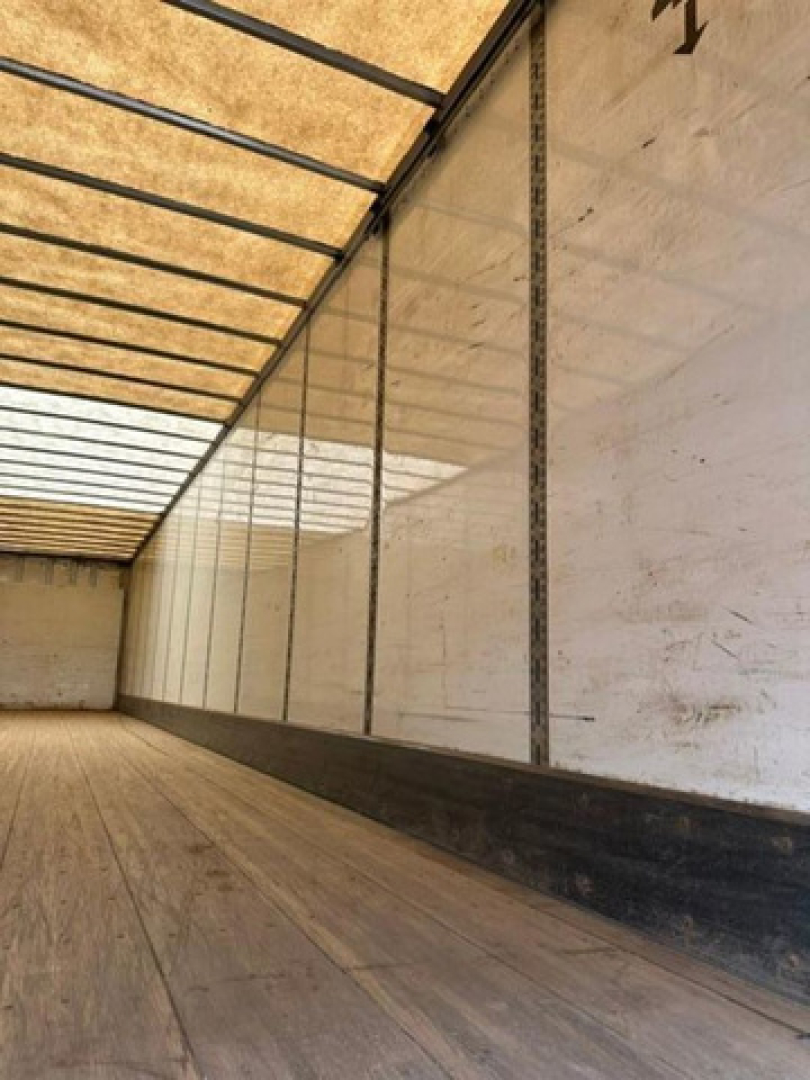 Wabash van trailer interior showing empty cargo area with wooden floor and insulated walls.