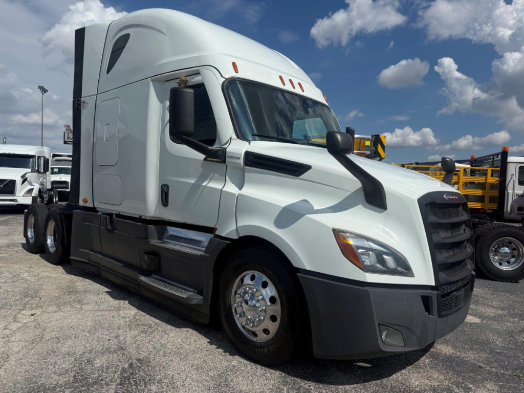2021 Freightliner Cascadia 126 tractor cab front and side view with stock number plate; no identifying labels on the image besides the cab and trailer.
