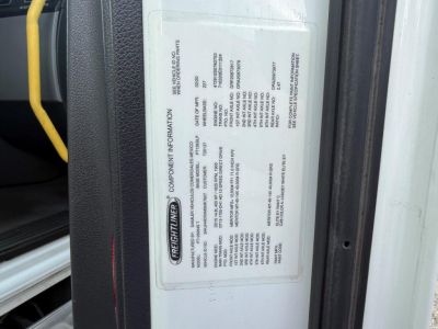 Truck door label with Freightliner component information and specifications for a 2021 Cascadia 126. Text blocks include model and VIN details.