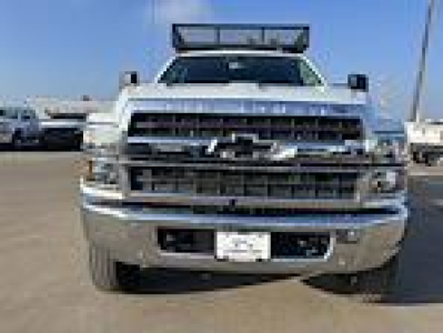 Front view of a Chevrolet Silverado flatbed truck with chrome grille and bumper, lifted light bar on roof, stock number 7226.