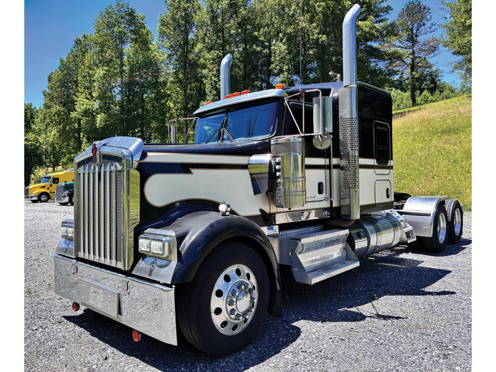 Kenworth W-900 AeroCab 2019 conventional sleeper truck with chrome exhaust stacks and polished metal accents.