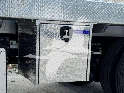 Sewer rodder truck side saddle fuel/toolbox area with diamond plate aluminum toolbox and wheel, 2023 Mack MD7