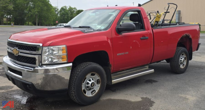 2012 Chevrolet Silverado 2500HD pickup truck in red, 2WD long-bed, shown from front-left side.