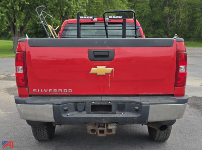 Chevrolet Silverado 2500HD pickup truck rear view showing tailgate with Chevrolet bowtie emblem and bumper hitch receiver.