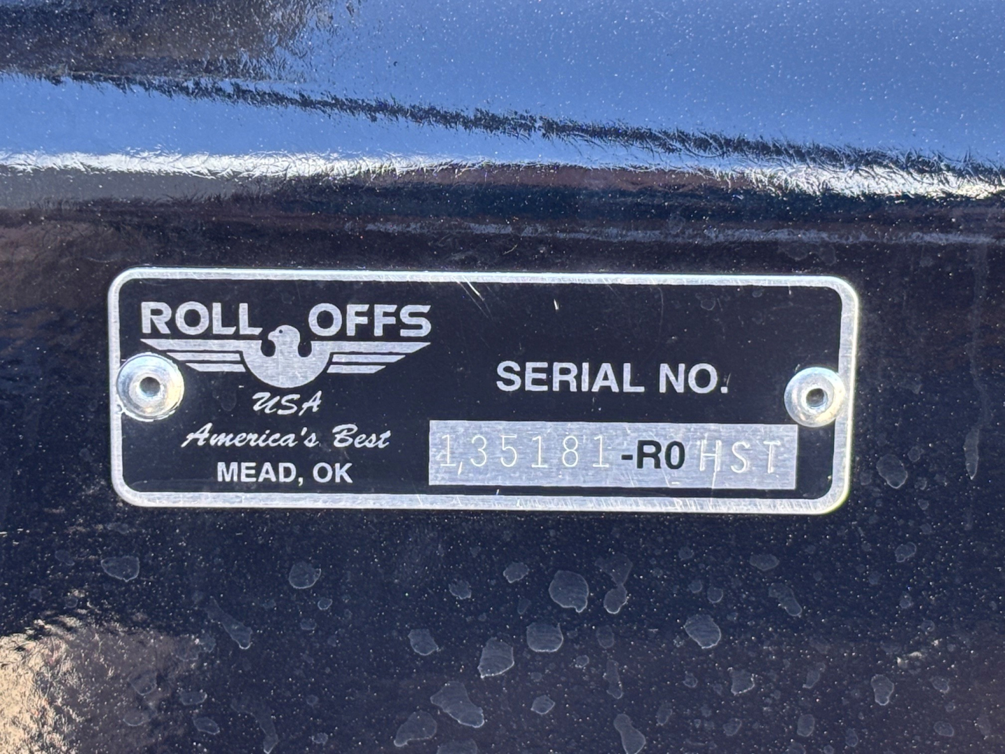 Roll-Offs USA plate sticker showing SERIAL NO. 135181-ROHST on a Mack GR64B chassis plate.