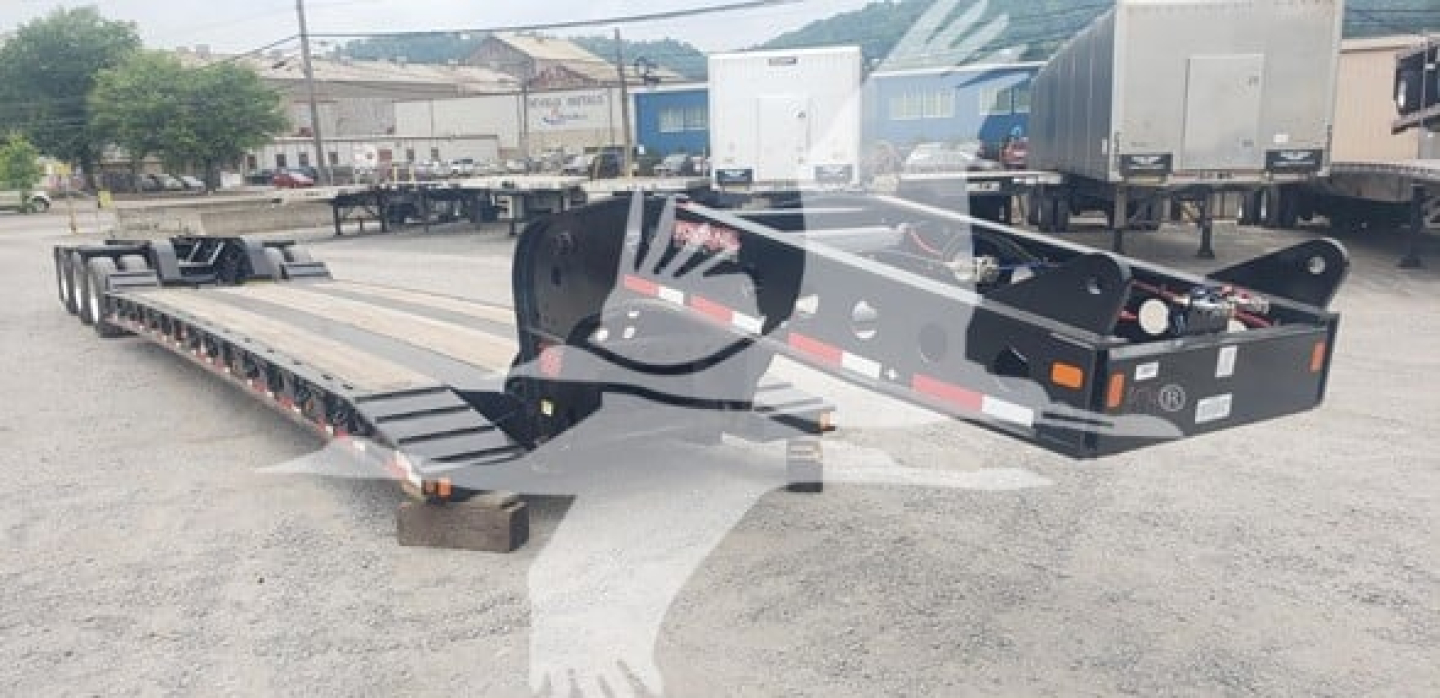  Fontaine 55Mx lowboy trailer showing long flatbed with gooseneck and wheel ramps.