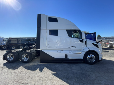 Volvo VNL truck tractor side view showing sleeper cab and rear dual-axle wheels.