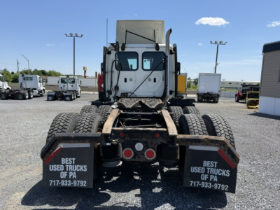 Rear view of a 2018 Freightliner Cascadia CA125DC tractor with dual rear axles and mud flaps reading Best Used Trucks of PA 717-933-9792.