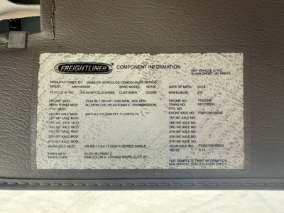 Freightliner M2 component information sticker in engine bay, listing model, base model, manufacturing details, VIN partial, and various specification fields.