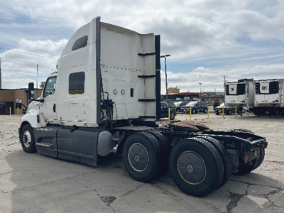 Truck tractor in-service showing International LT625 with sleeper cab and dual rear axles.