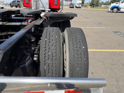 Kenworth T880 chassis showing dual rear wheels and part of the frame; visible tires with tread and the rear axle area.