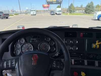 Kenworth T880 truck cab interior with steering wheel and dashboard controls visible
