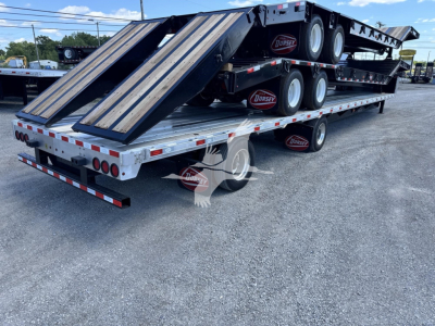 Dorsey combo drop trailer on a multi-axle flatbed. Dual loading ramps at rear, black deck, spare wheels, branding on tires, reflective safety tape along sides.
