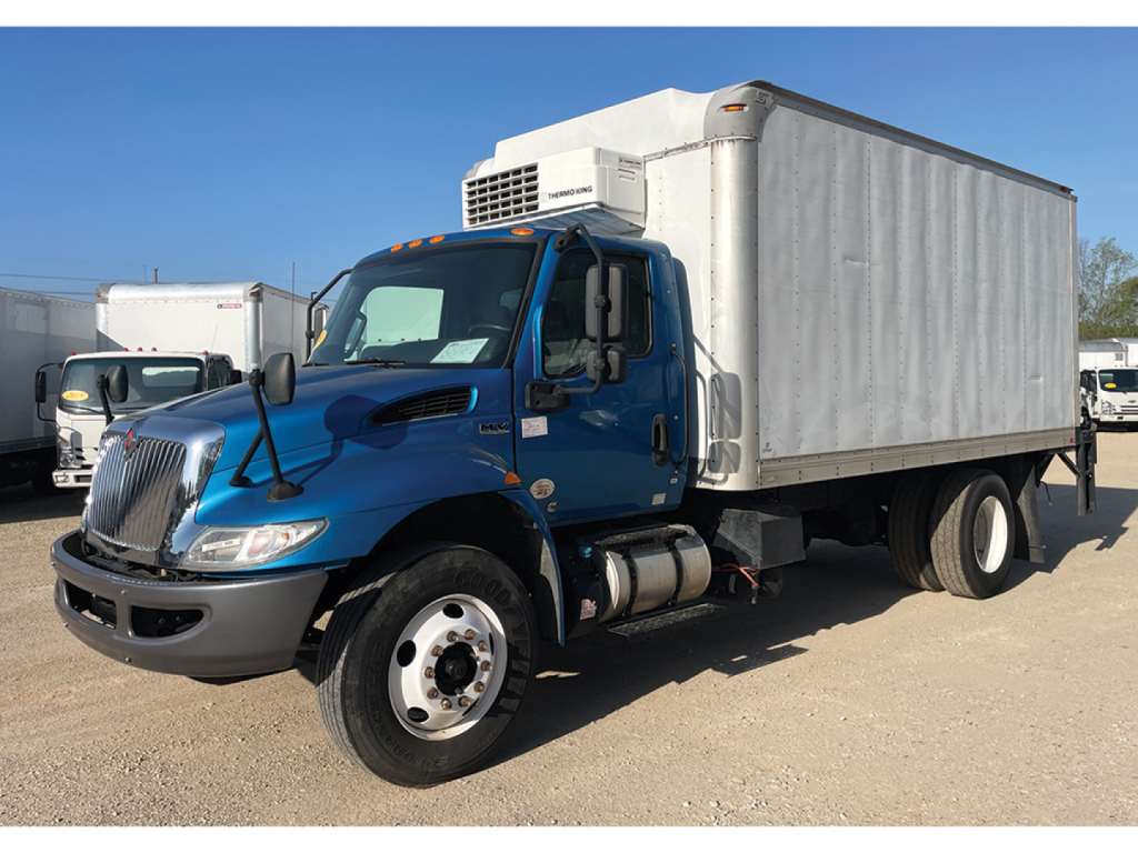 Blue 2020 International MV607 box truck with refrigerated cargo area, front grille, side mirrors, and white cargo box.