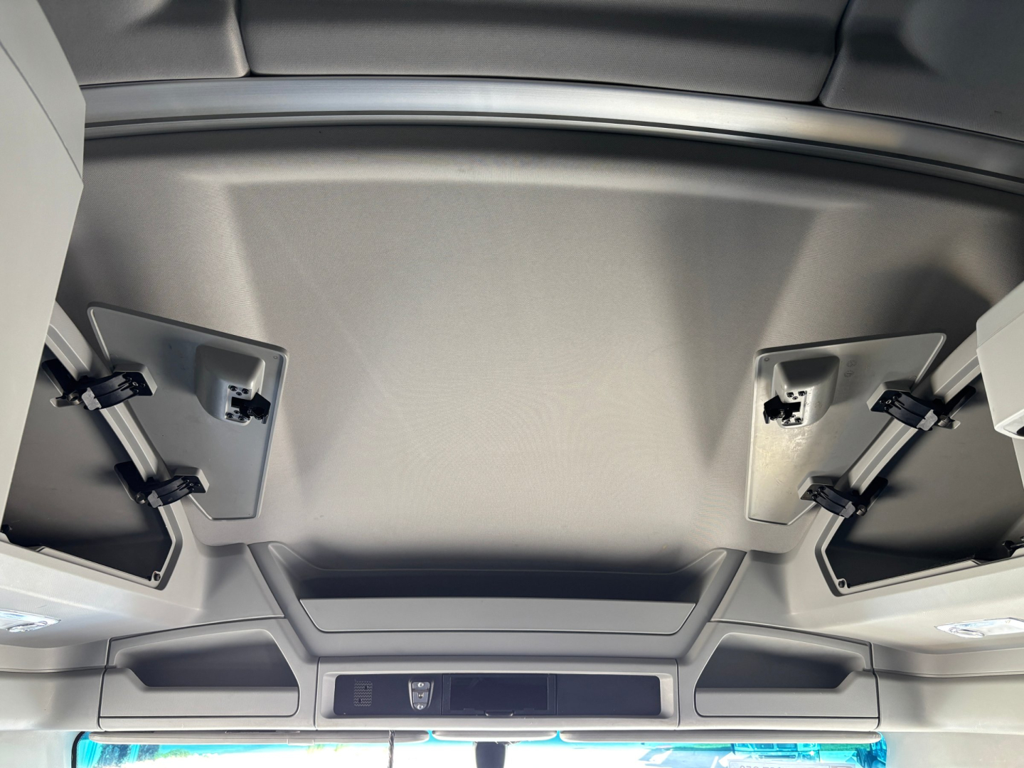 Kenworth T680 truck interior ceiling showing sun visors and overhead storage panels